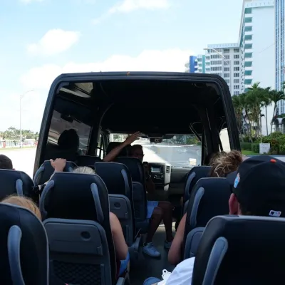 a group of people sitting on a bus