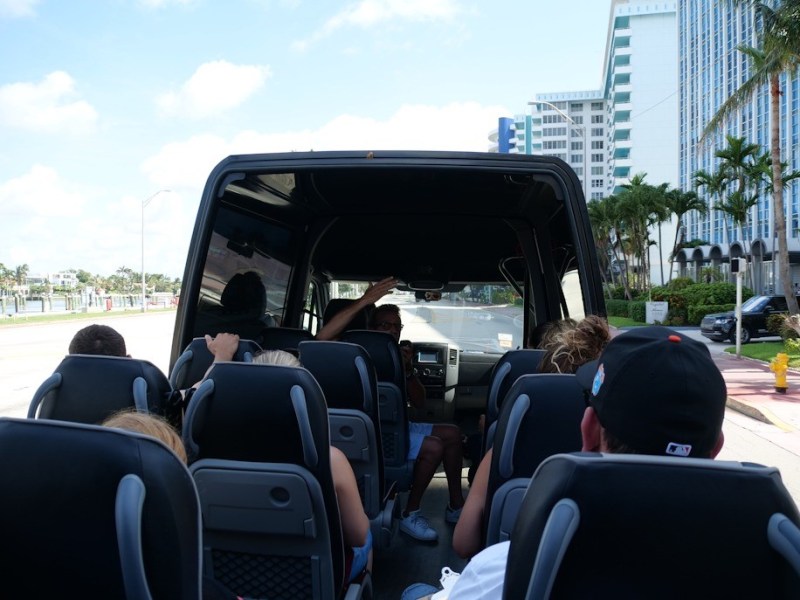 a group of people sitting on a bus