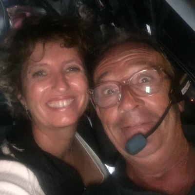 a smiling man and woman taking a selfie