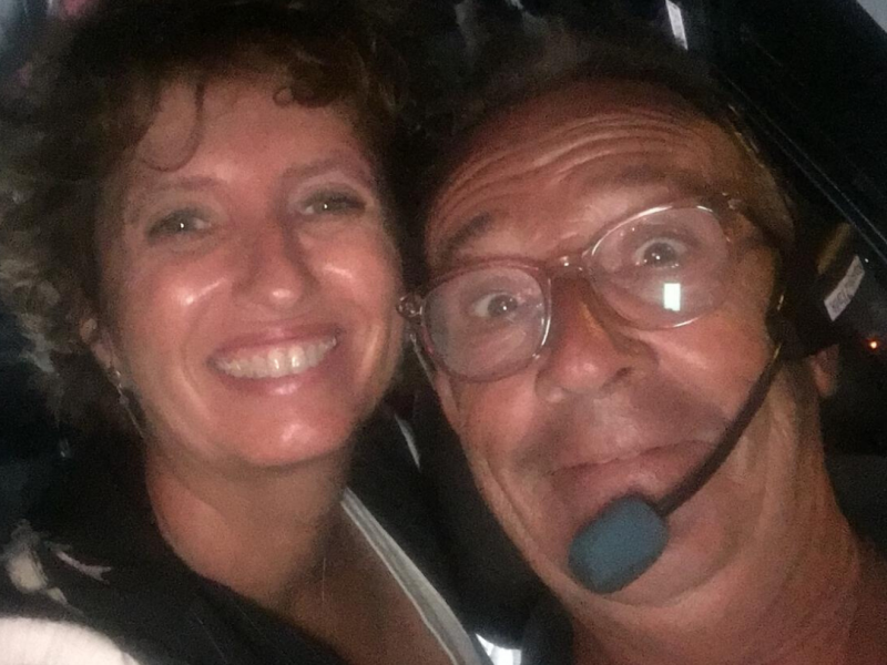 a smiling man and woman taking a selfie