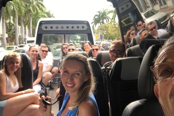 a group of people sitting on a bus