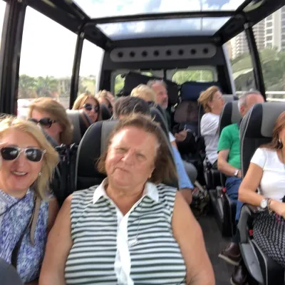 a group of people sitting on a bus