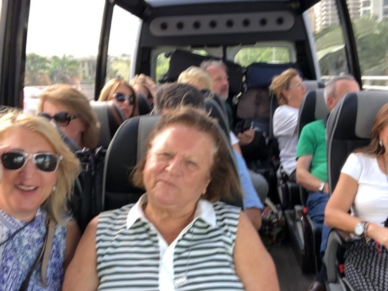a group of people sitting on a bus