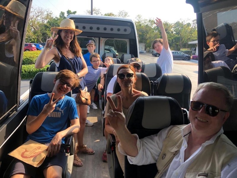 a group of people sitting on a bus