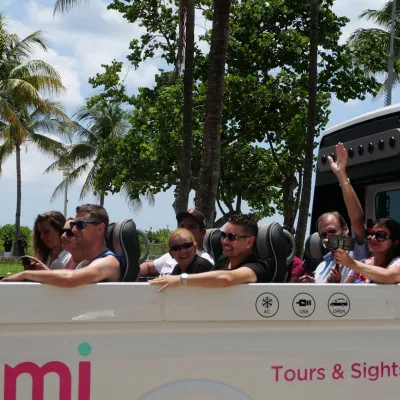 a group of people riding on the back of a truck
