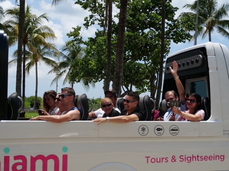 a group of people riding on the back of a truck