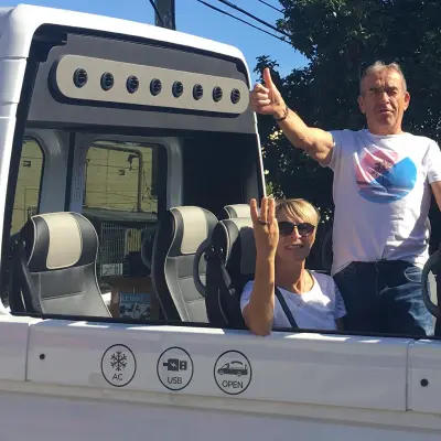a person standing in front of a bus