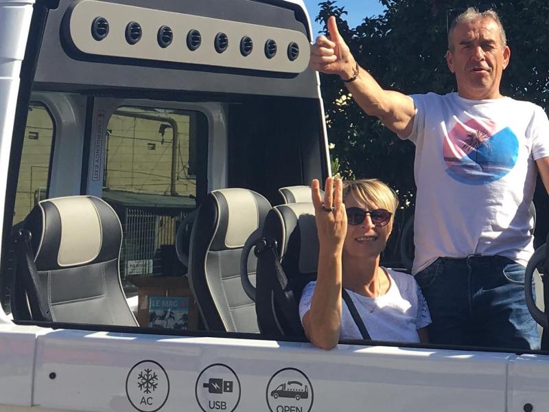 a person standing in front of a bus