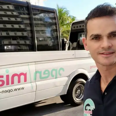 a man standing in front of a bus