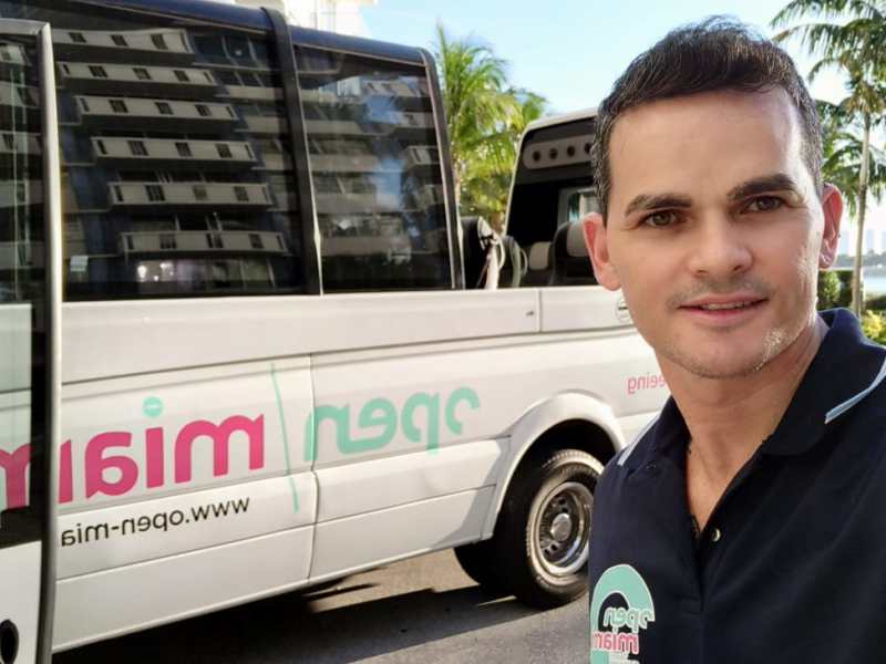 a man standing in front of a bus