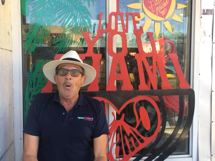 a man sitting in front of a building