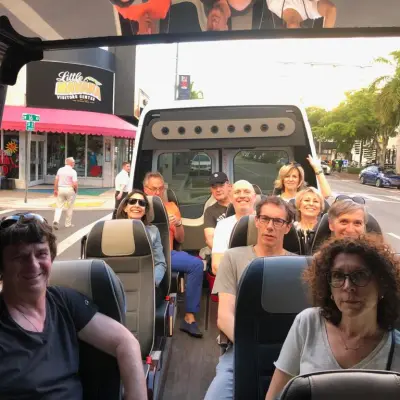 a group of people sitting on a bus