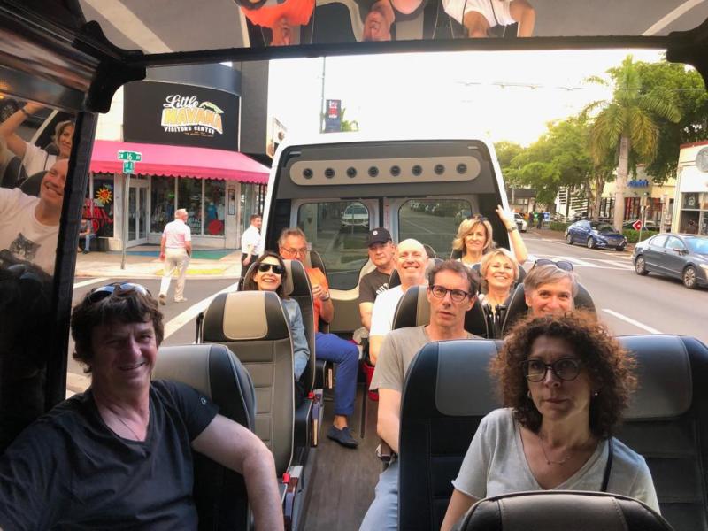 a group of people sitting on a bus