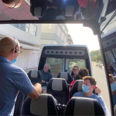 a group of people sitting on a bus