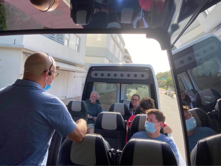 a group of people sitting on a bus