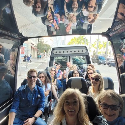 a group of people sitting on a bus