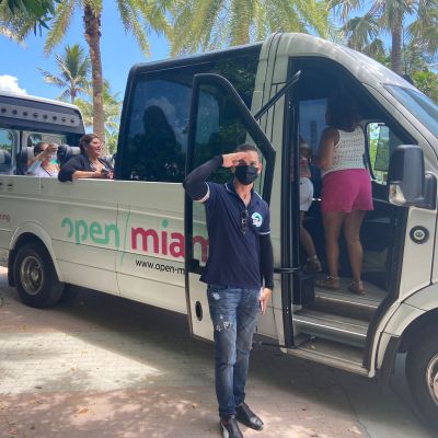 a man standing in front of a bus