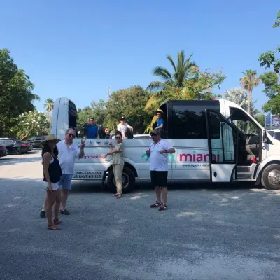 a group of people standing in a parking lot