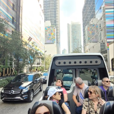 a group of people riding on the back of a truck